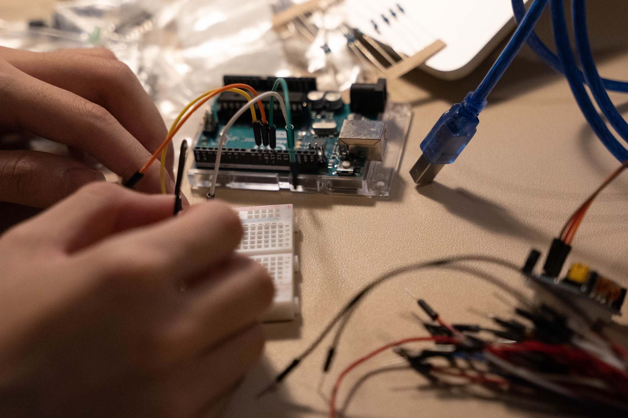 Close view of electronic components and wiring on a breadboard.
